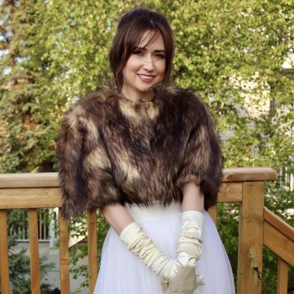 Bridget capelet in brown and gold faux fur.