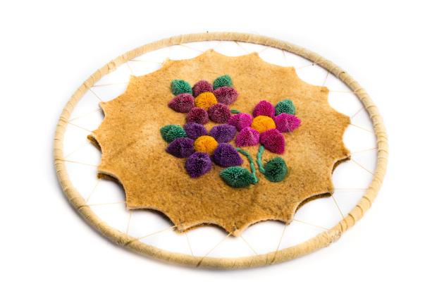 Tufting on traditionally tanned hide