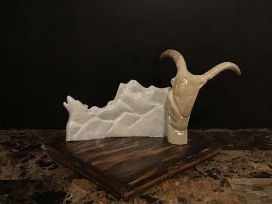 Moose horn carved mountains with caribou horn carved ram