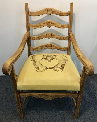 Reclaimed chair, deer hide, and woodburning