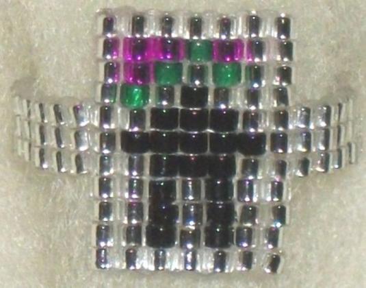 Beaded ring of Inukshuk under the Aurora Borealis