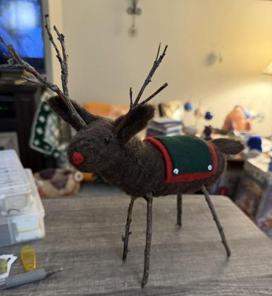 needle felted reindeer with blanket