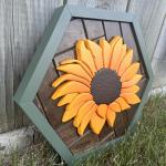 Hand cut sunflower on a hexagon shaped herringbone backrground